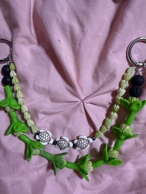 Double strand purse lei with handmade Pikake and Pakalana flowers.